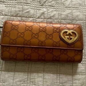 Authentic Gucci wallet bronze color. Like new